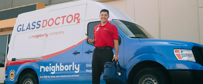 Glass Repair Rockwall and Kaufman Glass Doctor Tech standing in front of company truck. Glass Doctor A Neighborly Company.