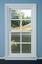 a white double hung window installed in a blue wall