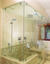 frameless all-glass shower enclosure with ceiling mounting and swinging door