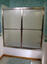 framed tub enclosure with sliding door and decorative glass