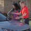 Glass Doctor technician talking with customer about their windshield