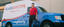 Glass Doctor Tech standing in front of company truck. Glass Doctor A Neighborly Company.