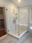 Glass Doctor shower installation with low iron enclosure and square handle